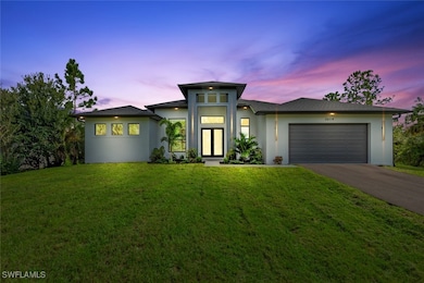 View of front facade featuring stucco siding, asph