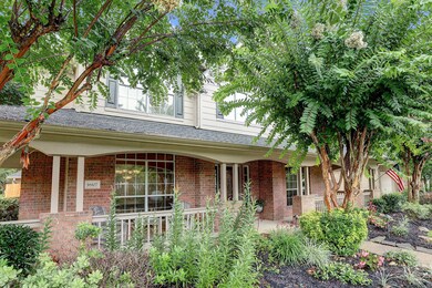  Lush landscaping with manicured crepe myrtles welcome you in to a gracious front porch that extends the length of the home.