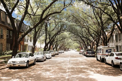 The street is lovely with the oak trees adding sha