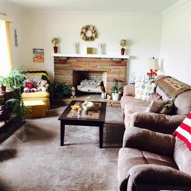 Living room with decorative stone fireplace