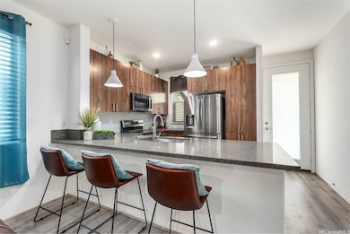 Spacious island with bar seating offers the perfec