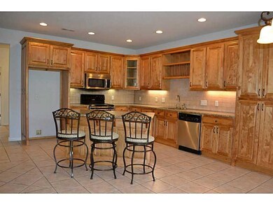 Kitchen. Look at all those cabinets in your kitchen!  Granite and Stainless appliances.  HUGE island!