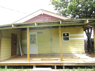 Back of property with a wooden deck