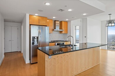 Kitchen with wall chimney range hood, stainless s