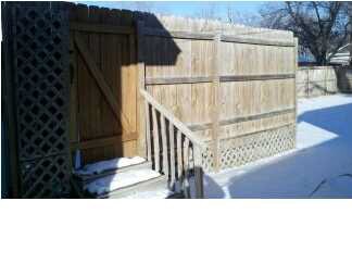 IN SIDE FENCED YARD IS THIS PRIVATE FENCED DECK.