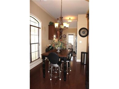 Lovely dining room is embellished with a gorgeous 