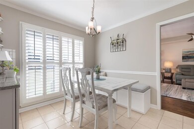 More floor to ceiling windows flood this dining ar