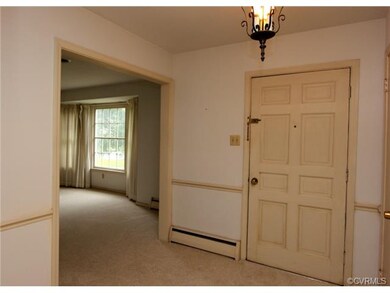 FOYER WITH HARDWOODS UNDER THE CARPET, COAT CLOSET