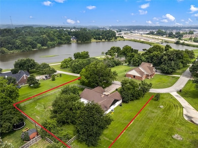 Literally minutes from everything. Schools, restaurants, shopping and Lake Conroe. Lake Lorraine is a private, no motorized lake that feeds into Lake Conroe. At the front of the neighborhood you have a private boat ramp for residents only to launch into Lake Conroe.