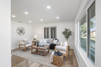 A view from the front entry into the living room. You'll also have a nice view of the pool and green belt.