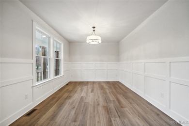 Off the entryway, a versatile flex room can serve