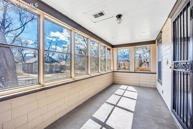 Enclosed Front Porch with view of Pikes Peak