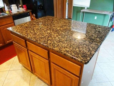 Large granite top kitchen island w/ storage & brea