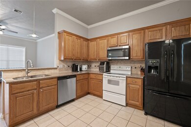Kitchen with appliances with stainless steel finis