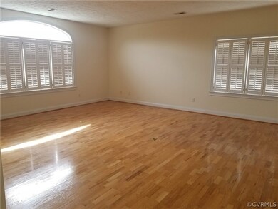 Great Room w/ wood floors, plantation shutters, 2 floor outlets