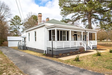 View of front of home with crawl space, a chimney,