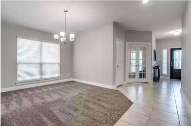 Spare room featuring an inviting chandelier, light