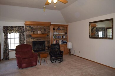 2nd living, ceiling fan, fireplace, entry to sunroom