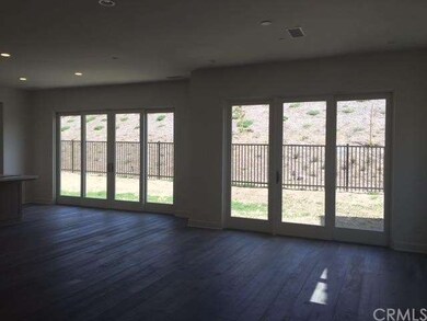 Great room with bi-fold doors to the backyard