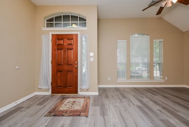 View of entry way and flex living area with newer