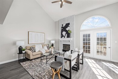 Lots of natural light coming in through the sunburst window and double doors leading to the deck!