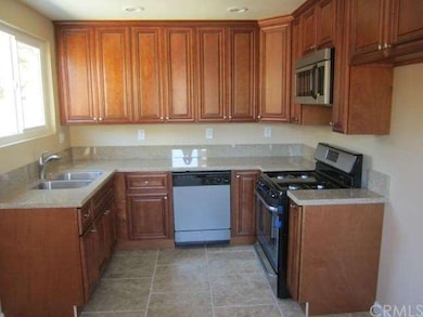 Custom kitchen cabinets with new stainless steel a