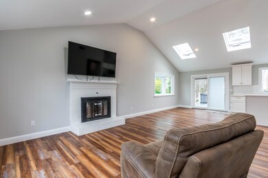 Living room with wood burning fireplace