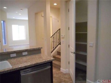 View of pantry, stairway and entrance to Guest bat
