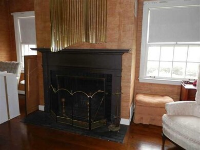 Living Room wood burning fire place in large forma