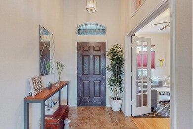 Entrance foyer with light hardwood / wood-style fl