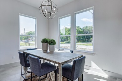 Large windows in dining space. Photo is from model