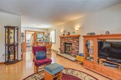 Open floor plan sharing the living room, dining ar