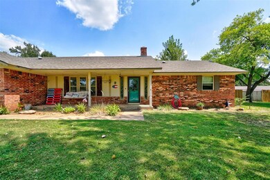 Ranch-style house with a front lawn