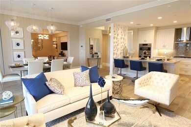 Living room featuring visible vents, baseboards, r