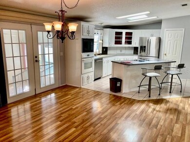 French doors and skylight invite the day to your eating space