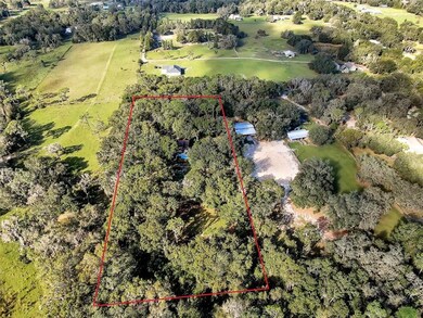 5 acres surrounded by mature trees and pastures