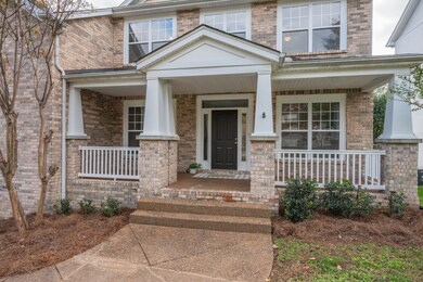 Greet guests and neighbors from your large covered front porch.