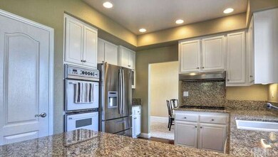 Gleaming kitchen boasts stainless steel appliances