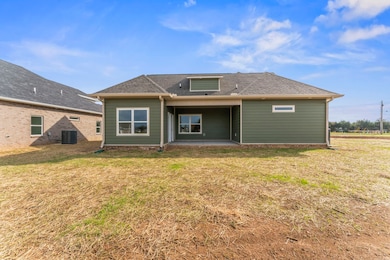 Access to the covered back porch is through the dining area, just off the kitchen.