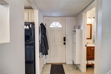 As you enter the home, you will be greeted by foyer hallway that leads to living room. Doorway to the right leads to half bathroom. Doorway to the left opens up to kitchen and dining area.