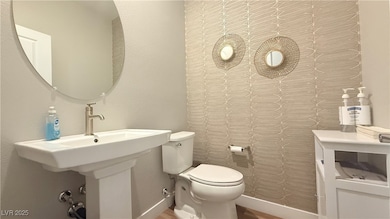 Bathroom featuring a textured wall