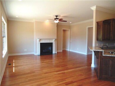 This is the view from the breakfast room to the great room. The open floor plan is perfect for entertaining. The breakfast room has an exterior door to the deck.