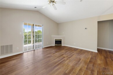 Unfurnished living room with ceiling fan, vaulted