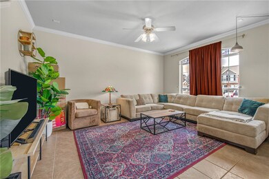 Living area featuring light tile patterned floors,