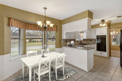 Light and bright breakfast area with low bar to kitchen ~