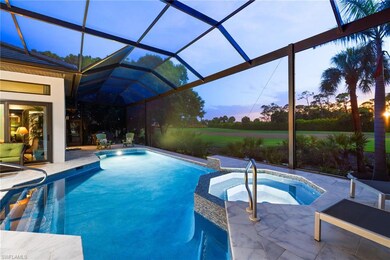 Swimming pool with an in-ground hot tub, a patio area, and a lanai