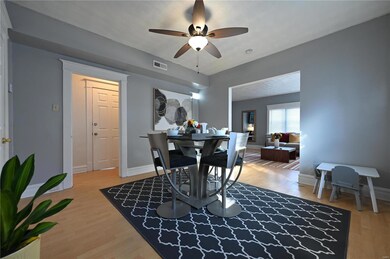 Dining space with wood-type flooring and ceiling fan
