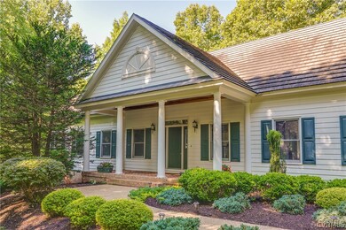 This well landscaped cape features professional landscaping and a lovely front porch - just bring your rocking chairs!