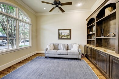 Formal Living Room with front facing windows and built ins.