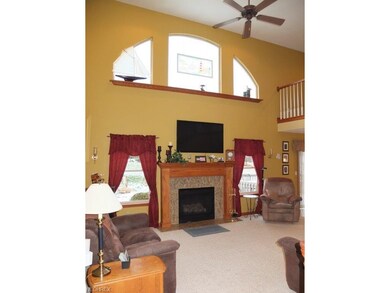2-story great room with a fireplace.